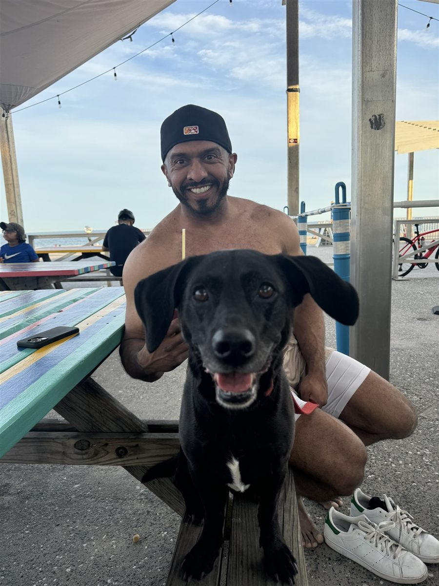 Jay and his dog at the beach